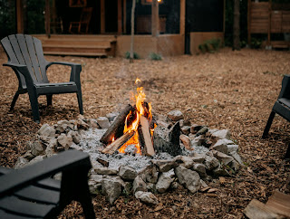 Chairs gathered around a campfire
